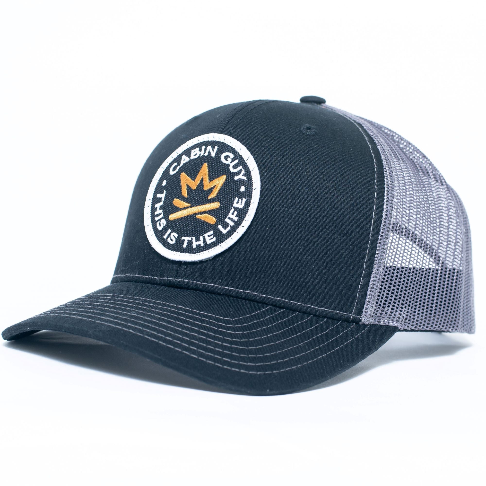 Woven patch snapback trucker hat for cabin owners